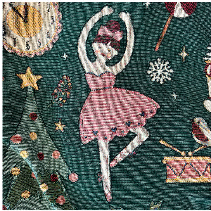 Natalie, the prima ballerina with fair skin and an auburn bun tied with a pink bow, balanced on one leg in a pink dress beside a star-topped tree.