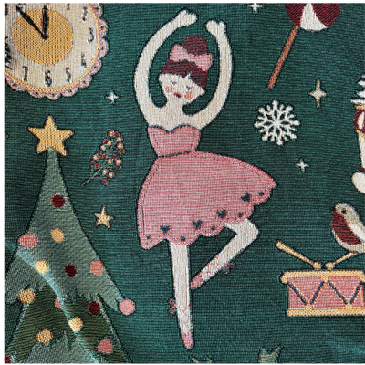 Natalie, the prima ballerina with fair skin and an auburn bun tied with a pink bow, balanced on one leg in a pink dress beside a star-topped tree.